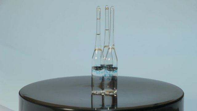 Ampoules rotate on a white background 5