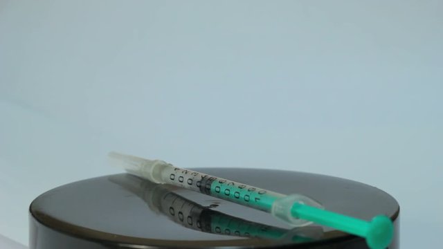 syringe rotate on a white background