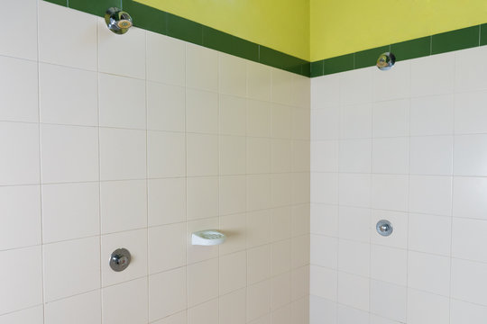 wall-mounted shower in a public locker room