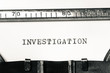 word investigation typed on typewriter