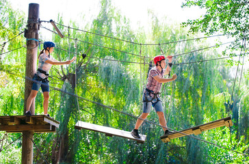 adventure climbing high wire park - people on course in mountain