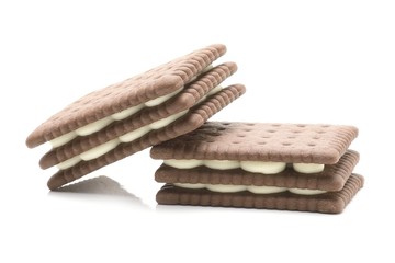 sandwich biscuits with white cream on white background