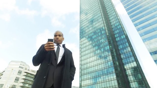 Black businessman in La Defense district, Paris, France