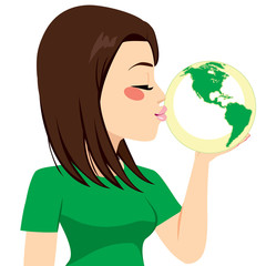 Beautiful young girl kissing green earth globe for recycling concept