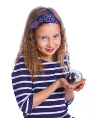 Cute girl holding a hamster