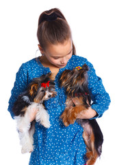 Girl playing with her yorkshire terrier