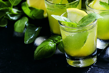 Lemonade with kiwi, green basil, grapefruit syrup and ice, black