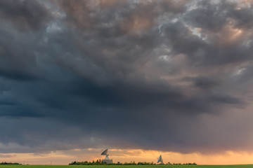 Observatory antennas and stormy clouds in HDR