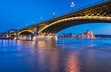 Fototapeta na wymiar Margaret Bridge with the Parliament in Budapest 