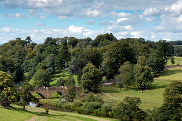 Fototapeta na wymiar Bridge over River Aln in the grounds of Alnwick castle