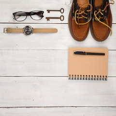 Travel concept - shoes, notepad, watch, glasses and vintage keys