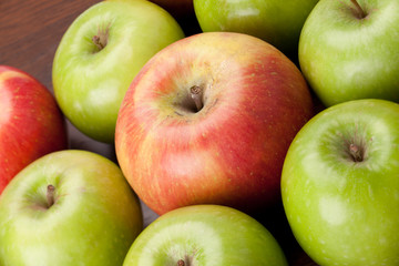 red apple stands out from pile