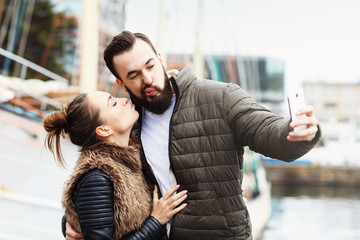 Young couple taking selfie