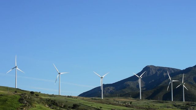 Wind turbines energy moving in the mountains
