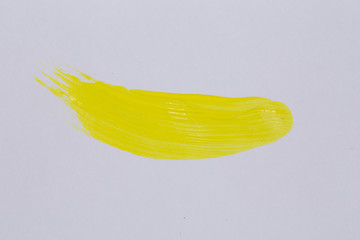 Yellow paint on white paper