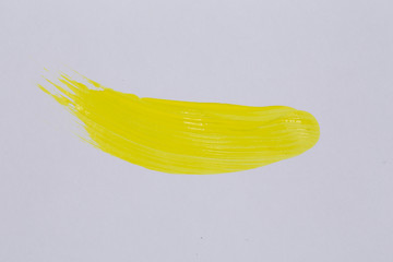 Yellow paint on white paper