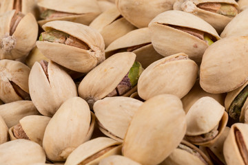 Pistachio nuts arranges as background