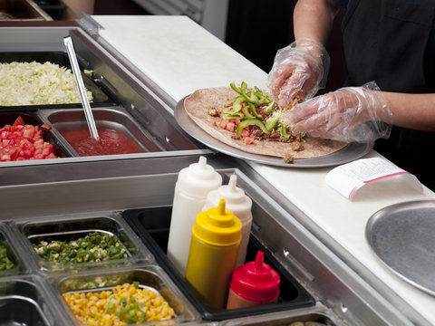 Close-up Of A Chef Making Burrito.