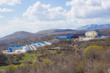 Fototapeta na wymiar Industrial plant in mountains