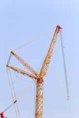 big crane on blue sky background.