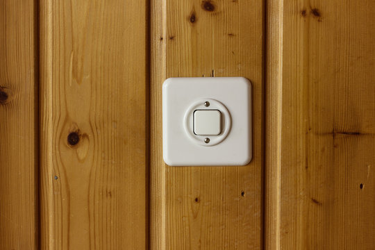 white light switch on wooden boards