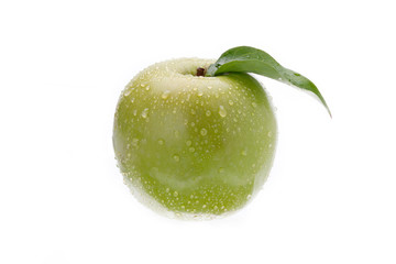 close-up shot of a wet green apple.