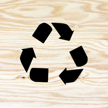  wooden texture with recycle symbol