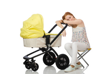 Woman with baby and pram isolated on white
