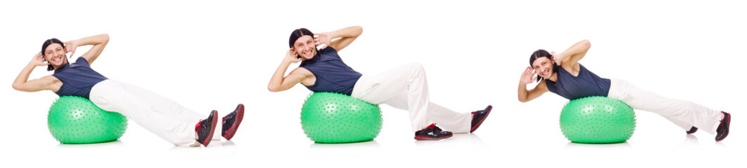 Man with swiss ball isolated on white