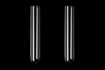 Two glass transparent test tubes on black background