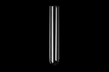 Glass transparent test tube on black background