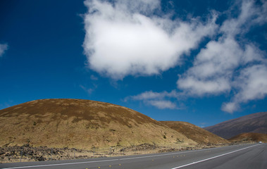 Driving on highway 200 through Mauna Kea hills to Hilo