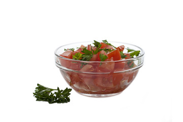bowl of sliced tomatoes with parsley