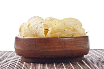 wooden bowl with sour cream and onion potato chips