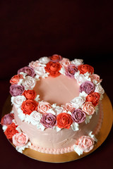 Birthday cake with red roses.