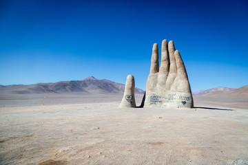 Las Manos, Chile - June 14th 2013 - The famous Las Manos monument in the middle of desert in...