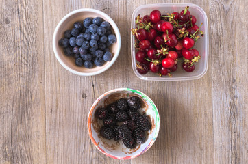 Berries on a wooden table in natural light