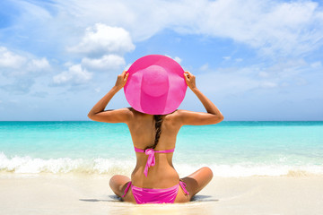 Cute pink bikini beachwear woman relaxing in perfect paradise destination on beach travel vacation....