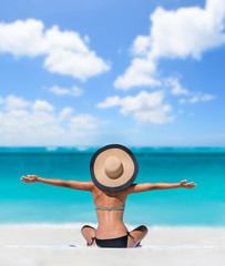 Happy freedom carefree bikini woman enjoying summer beach vacation with arms up cheering in...
