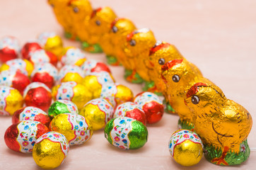 Easter chocolate little eggs andchicks covered in multicolor paper