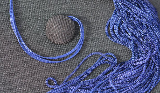 Detail Of A Black Mortarboard With Blue Tassel