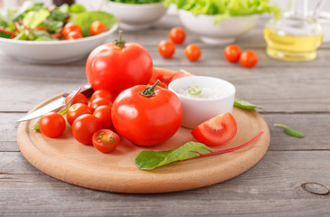 Fresh tomatoes on wooden table