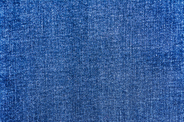Blue jeans material texture background close up