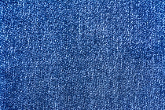 Blue jeans material texture background close up