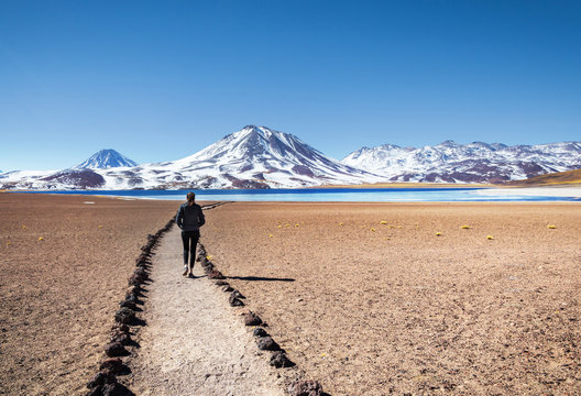 Tourist enjoying the beautiful landscape of Atacama Desert in Chile. Winter time.