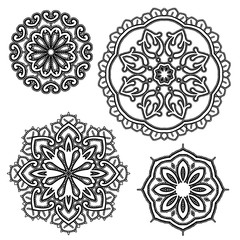 Set of Round floral lace ornaments - black on white background.