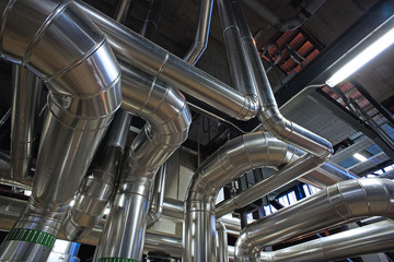 Fototapeta premium Equipment, cables and piping as found inside of a modern industr