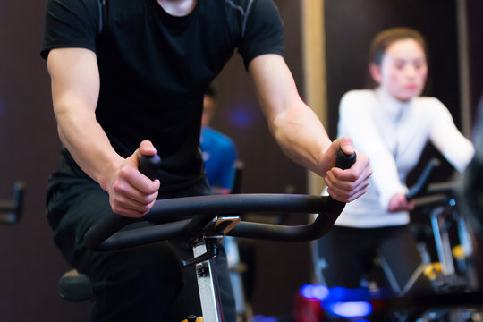 Young Asian People Working Out In Modern Gym