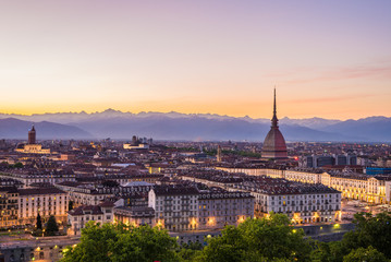 Fototapeta na wymiar Cityscape of Torino (Turin, Italy) at dusk with colorful sky
