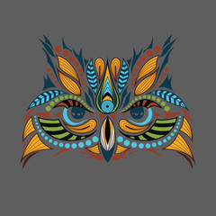 Patterned colored head of the owl. African / indian / totem / tattoo design. It may be used for design of a t-shirt, bag, postcard and poster.